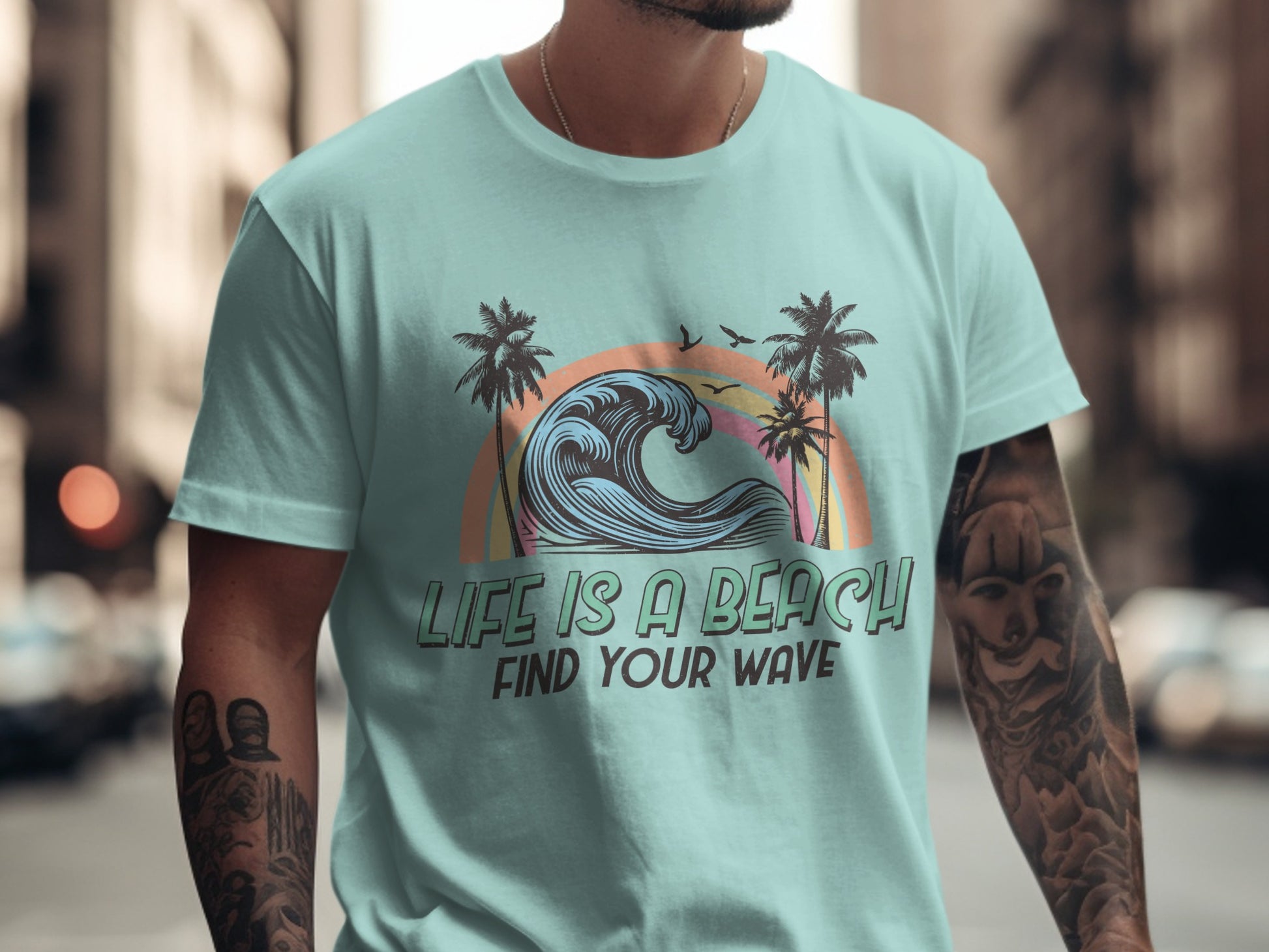 Light blue t-shirt with "Life is a Beach Find Your Wave" text and ocean wave graphic.