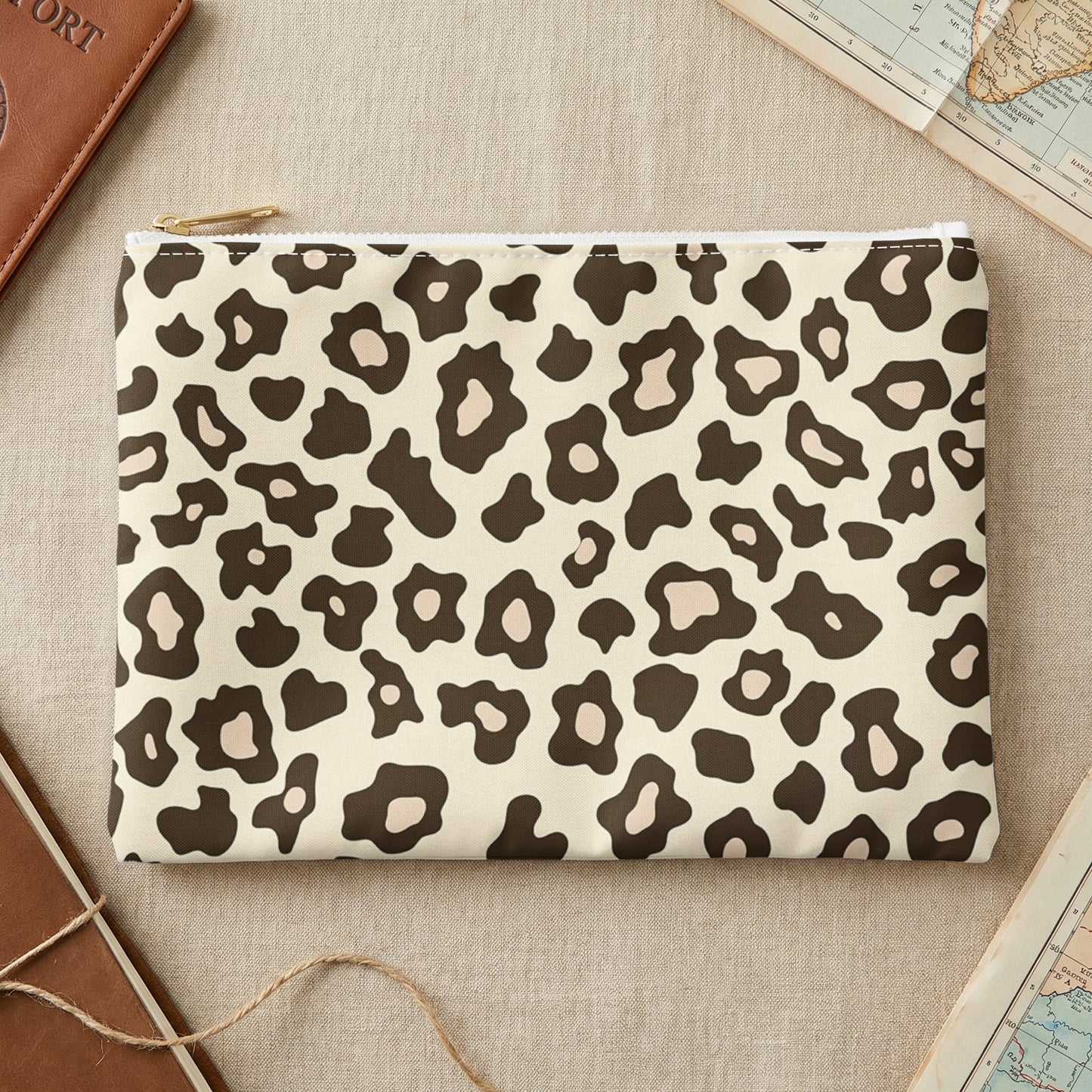 Leopard print zippered pouch with beige background and dark brown spots.