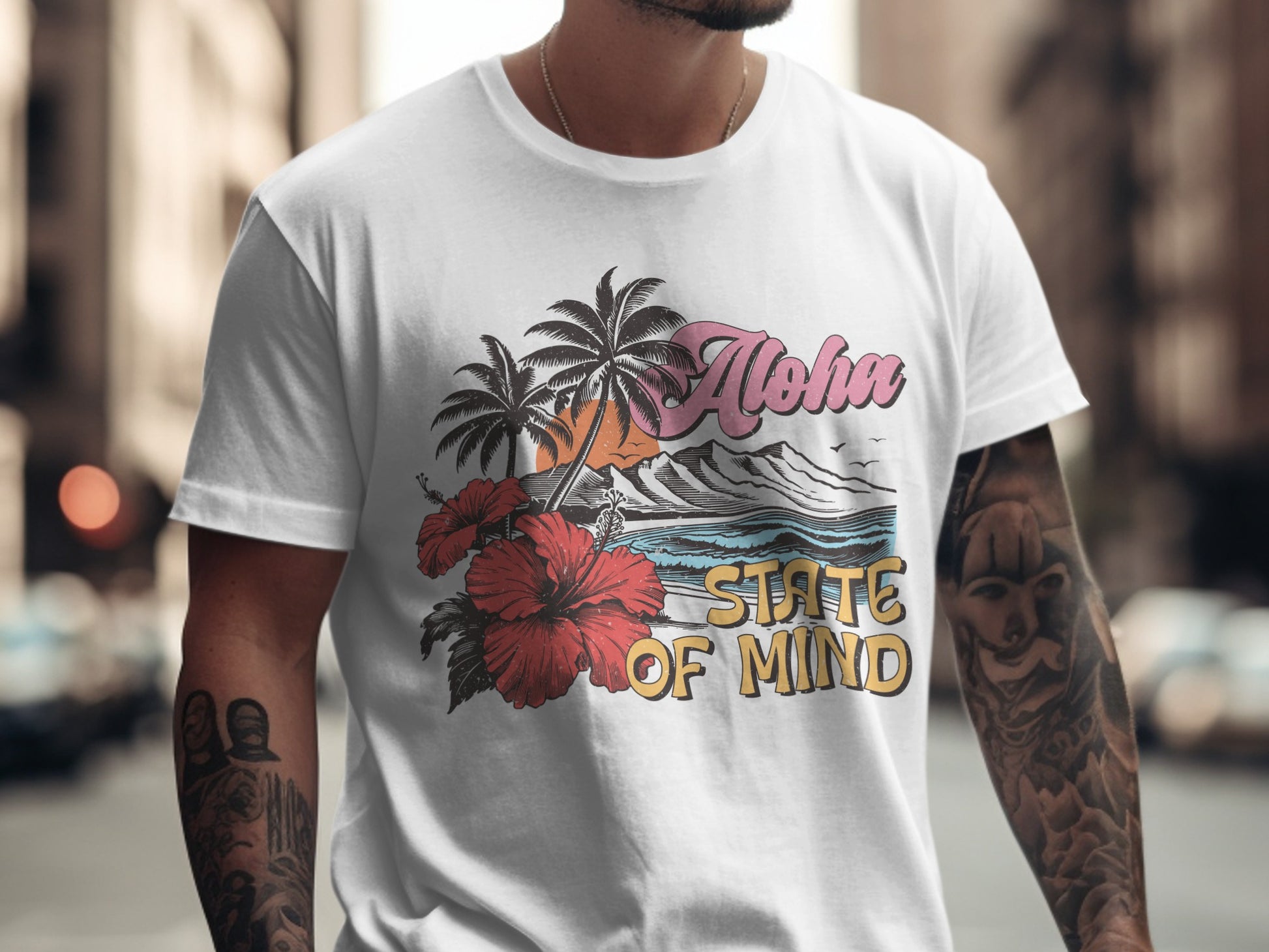 White t-shirt with "Aloha State of Mind" text and tropical beach graphic.