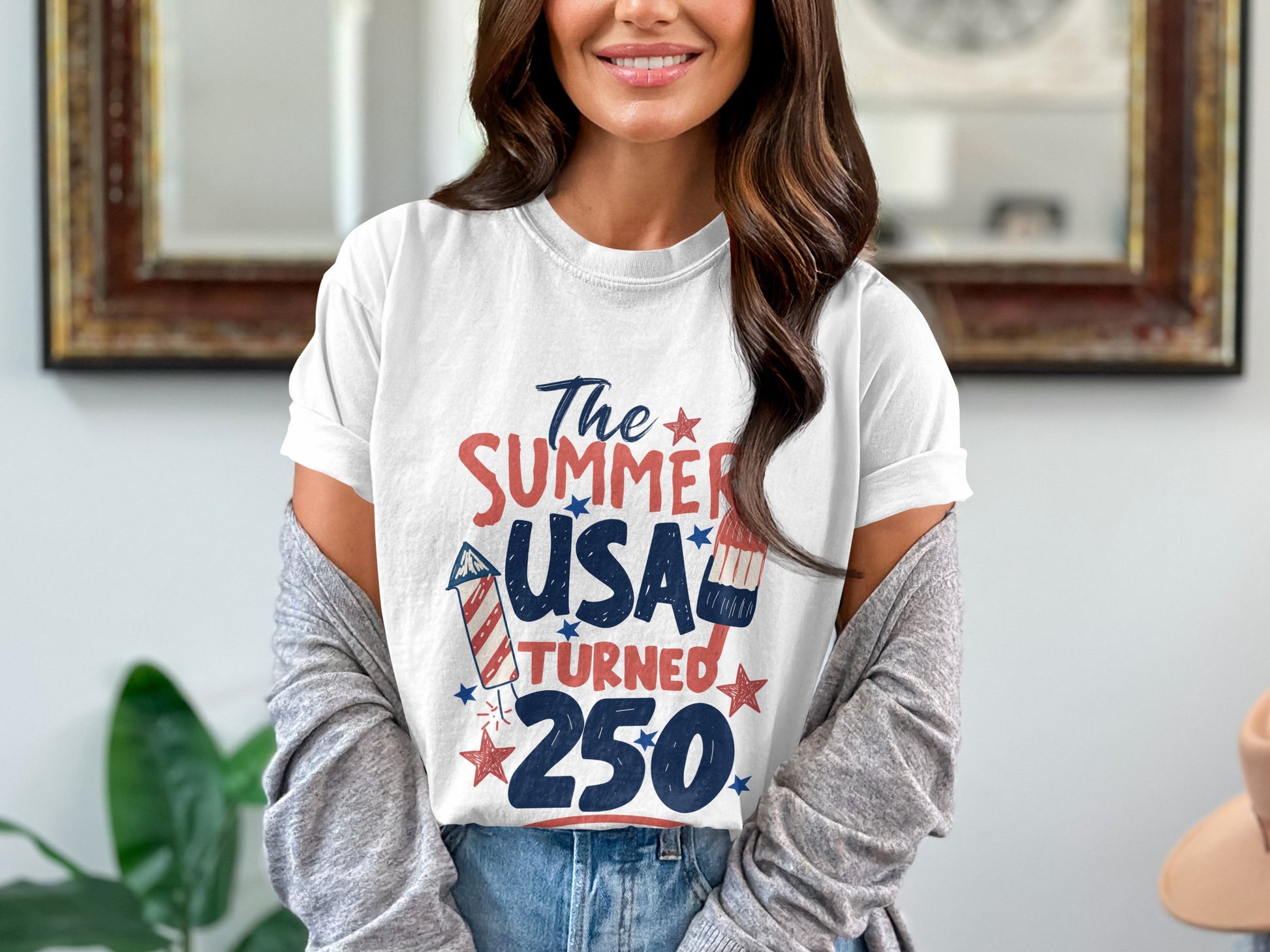 White t-shirt with "The Summer USA Turned 250" graphic.