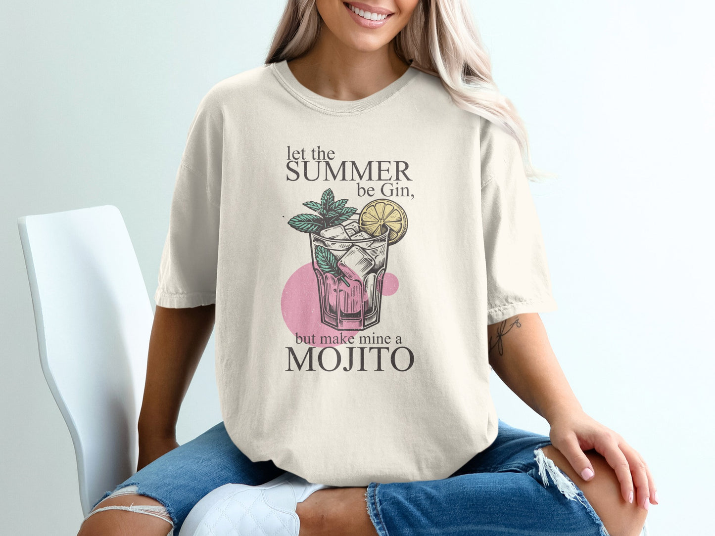 T-shirt with text "Let the summer be gin, but make mine a mojito" and mojito illustration.