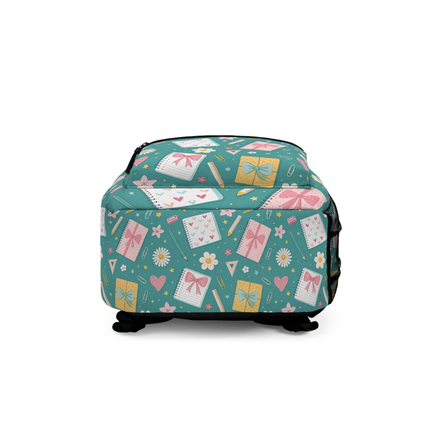 Teal backpack with a cute pattern of notebooks, gifts, hearts, and flowers.