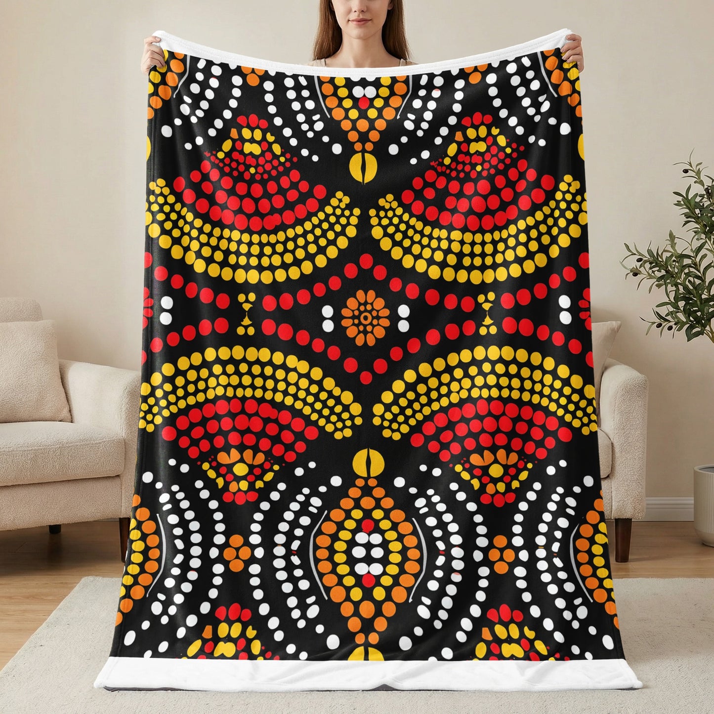 Black fleece blanket with red, yellow, and white dot art pattern.