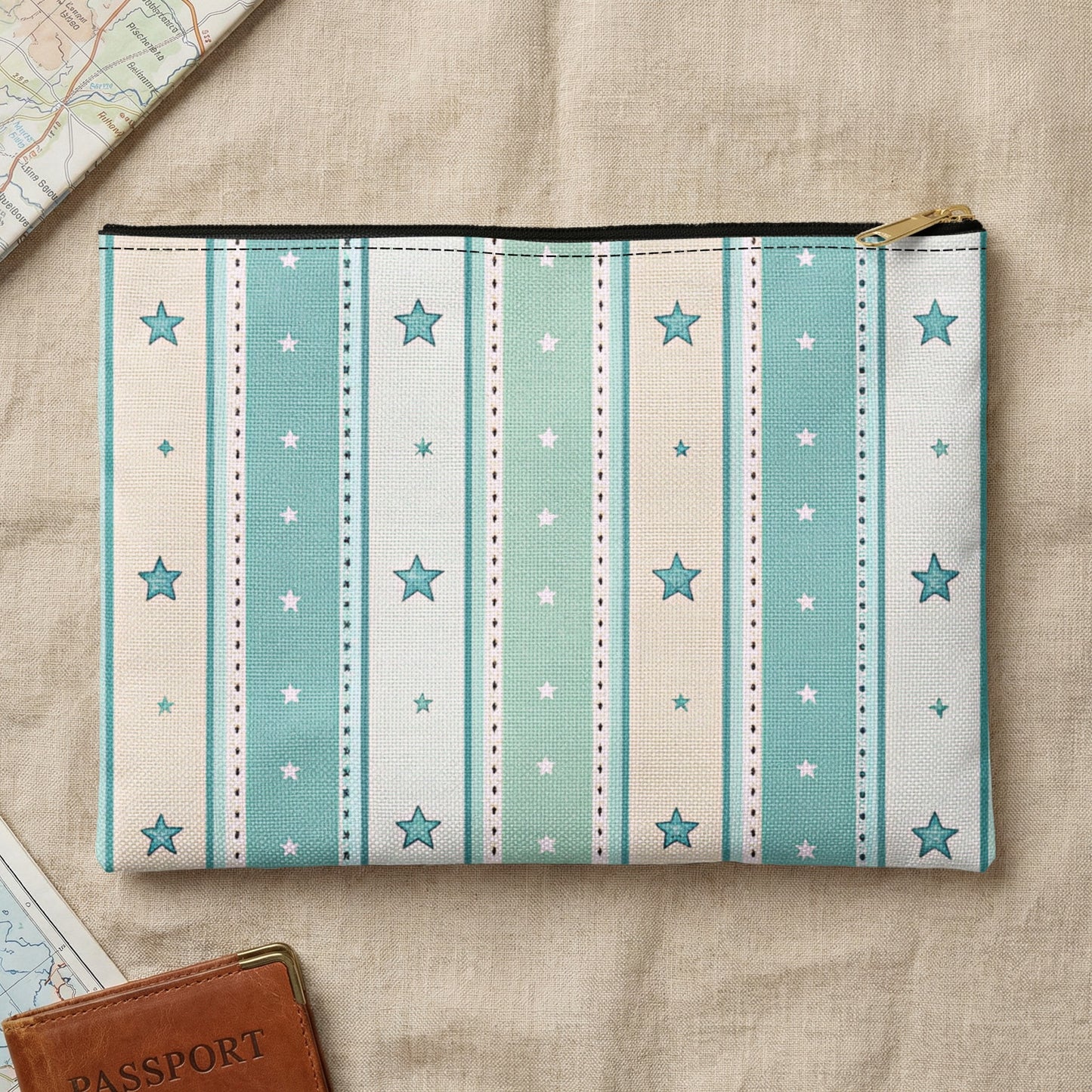 Zippered pouch with blue and tan stripes, white stars, and gold zipper.