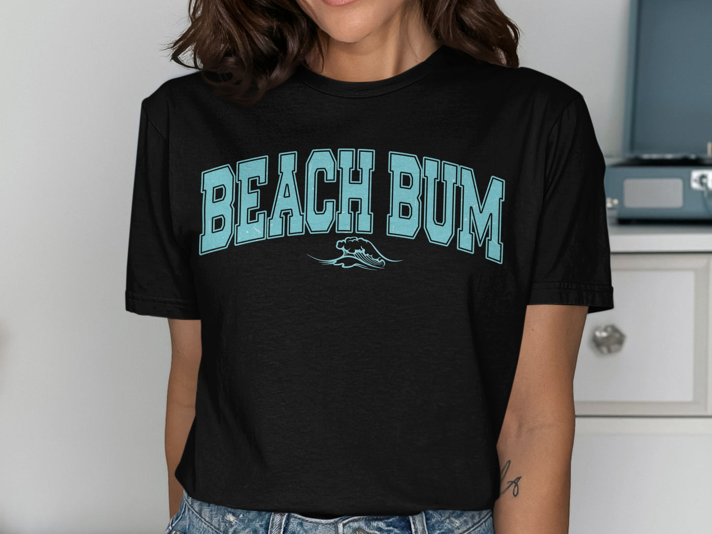 Black t-shirt with light blue "BEACH BUM" text and a wave graphic.