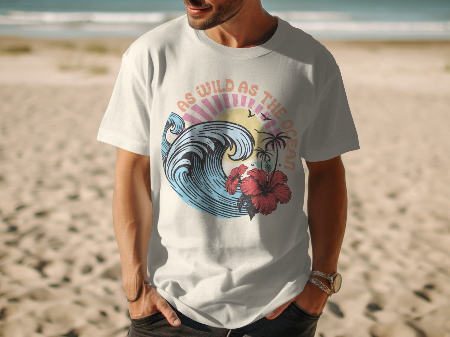 White t-shirt with "As Wild As The Ocean" text and wave graphic.