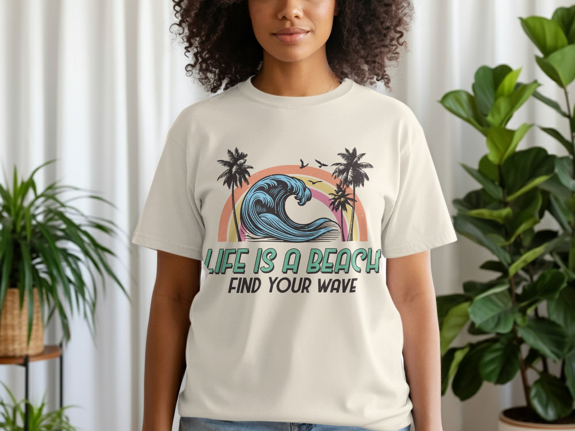 T-shirt with wavy ocean, palm trees, and text "Life is a Beach, Find Your Wave."