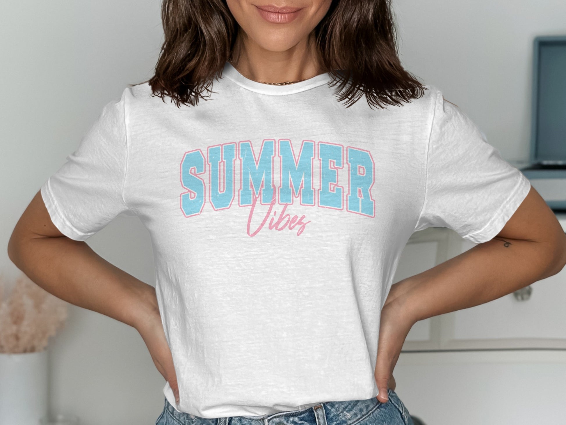 White t-shirt with "SUMMER Vibes" text in pink and blue.
