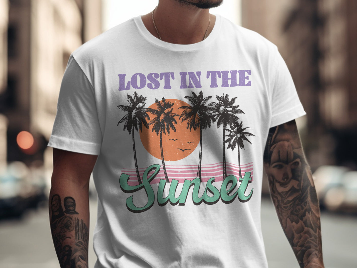 White t-shirt with "Lost in the Sunset" text and palm trees.