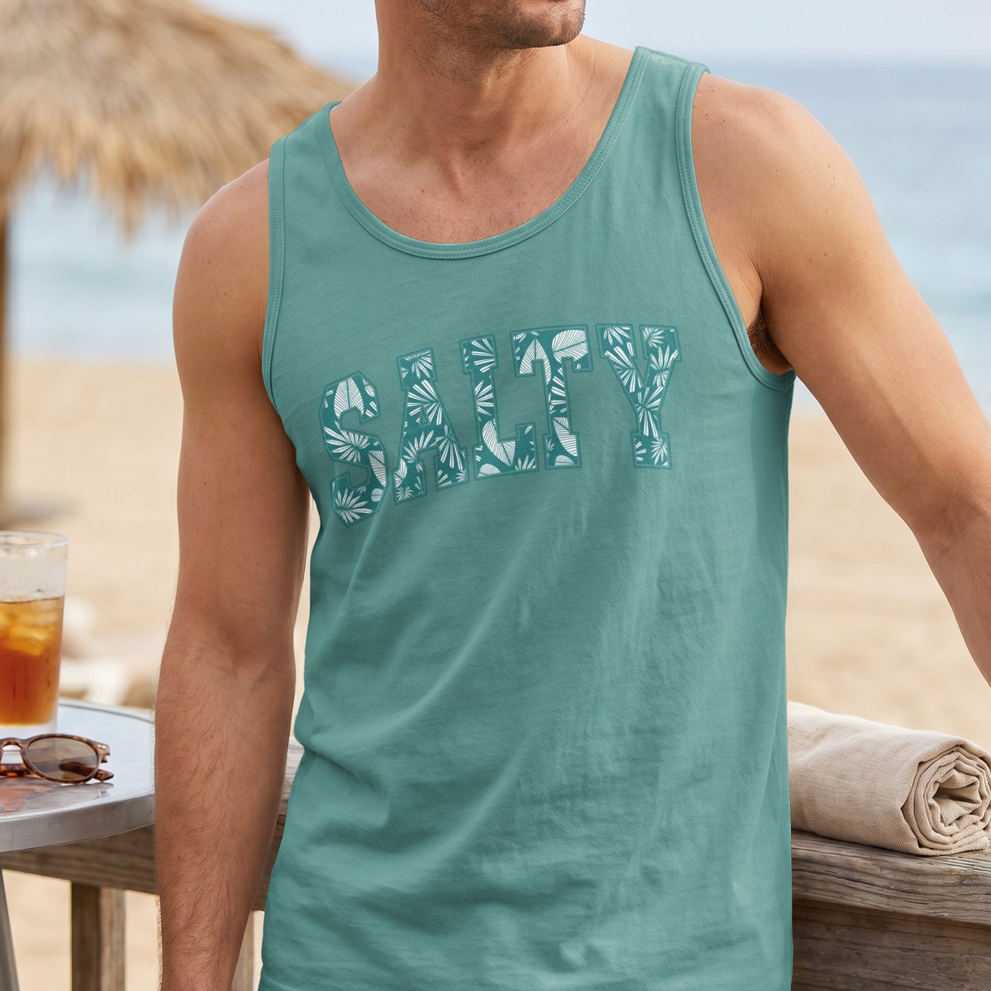 Teal tank top with white "Salty" text and floral pattern.