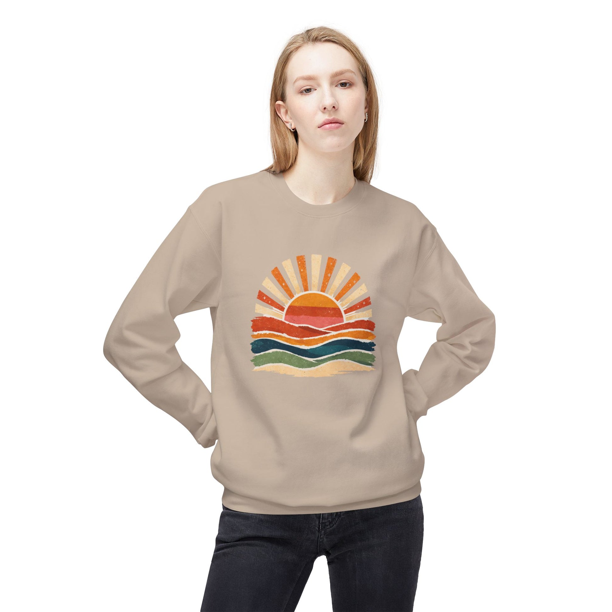 Woman wearing tan sweatshirt with colorful sunset graphic.