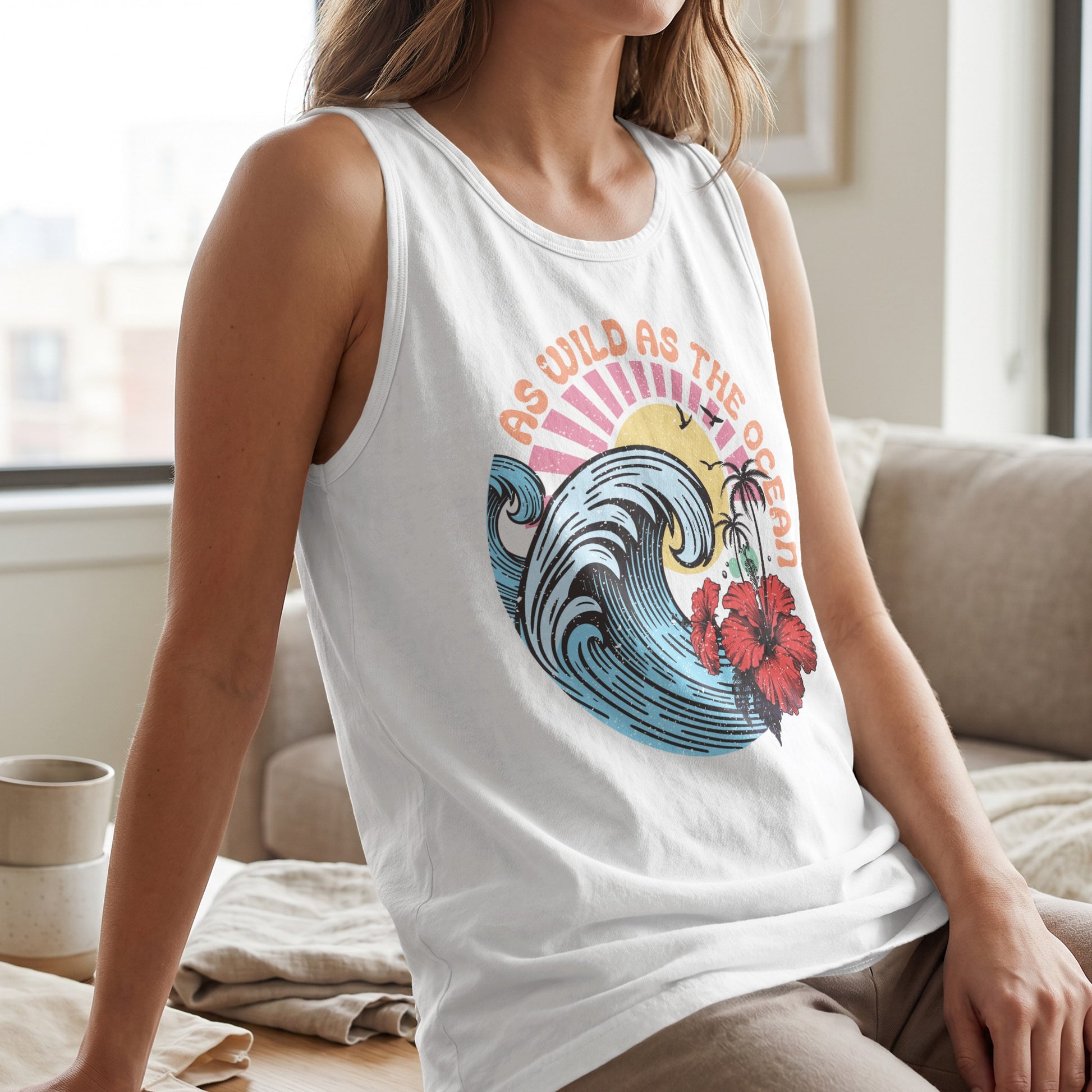 White tank top with a colorful ocean wave, hibiscus, and sunset graphic.