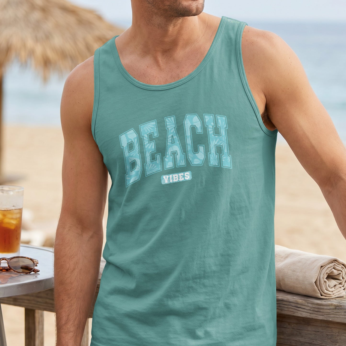 Teal tank top with "BEACH VIBES" text in tropical pattern.