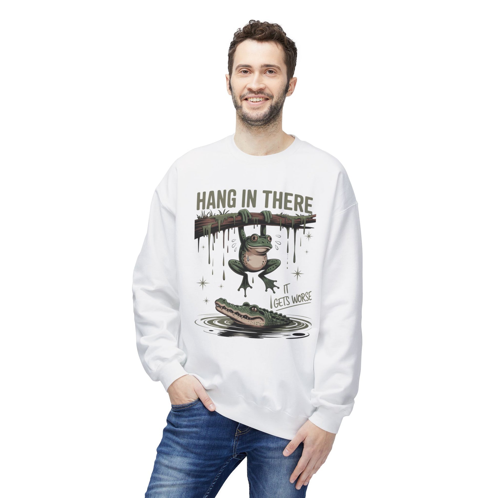 Frog hanging from branch above alligator, with text "Hang in there, it gets worse."