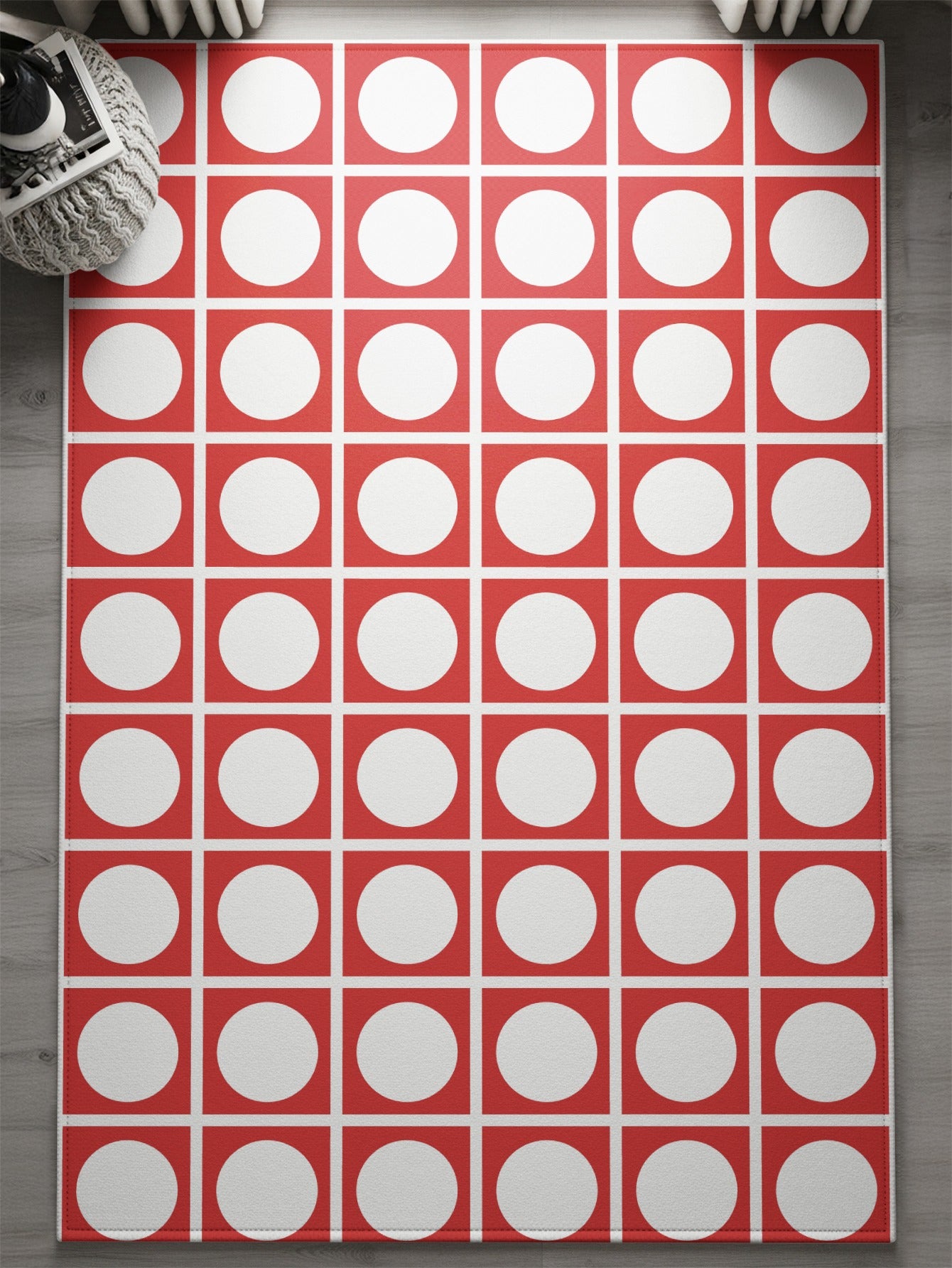 Red rug with a repeating pattern of white circles within red squares.