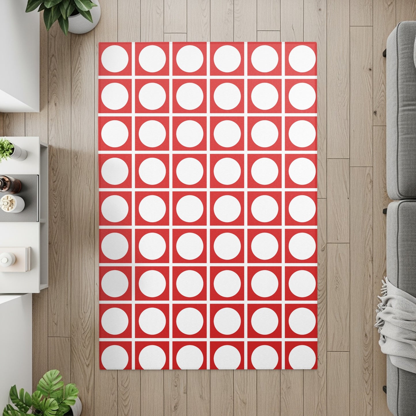 Red and white circular dot pattern rug on a wood floor.