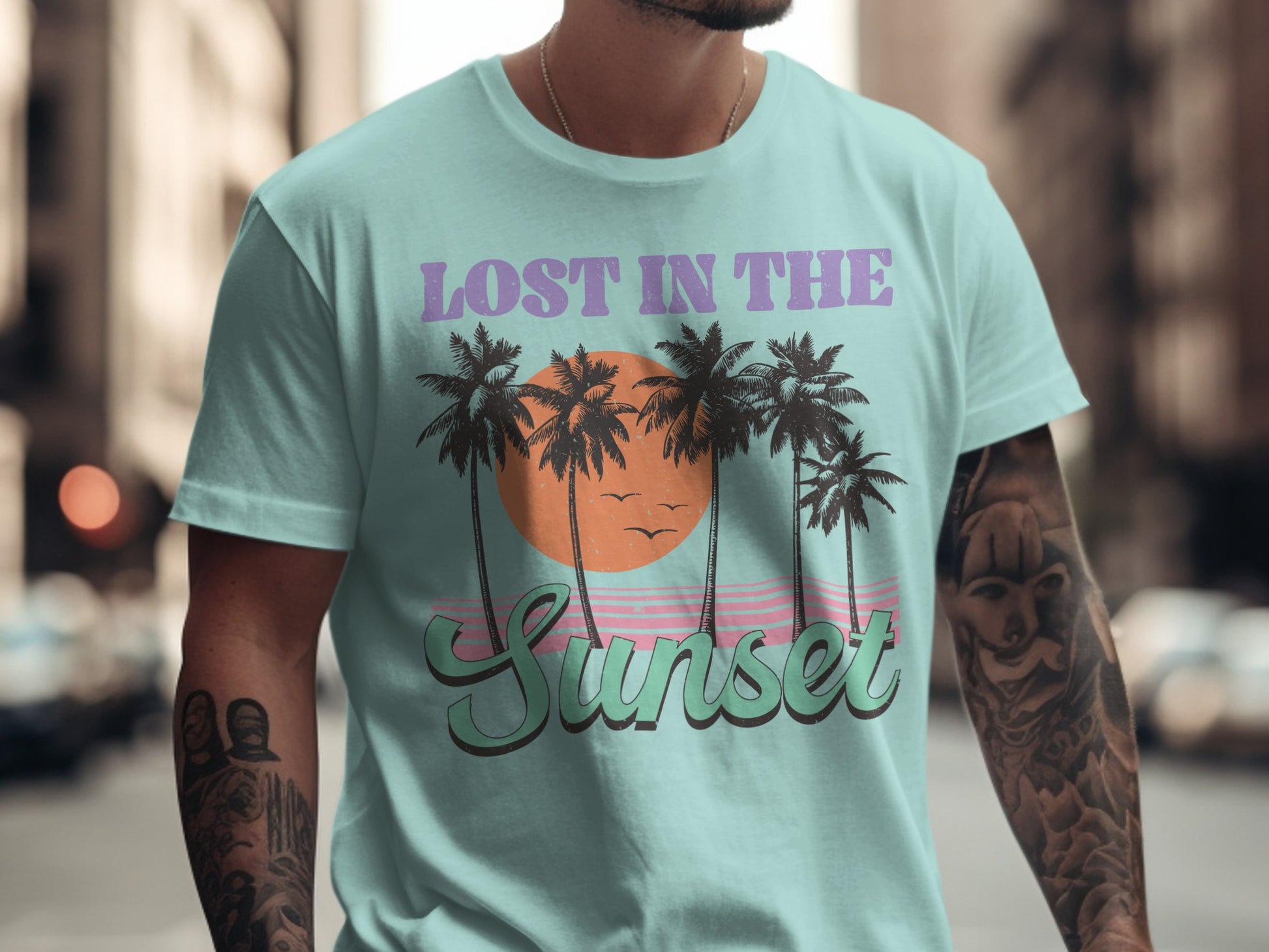 Mint t-shirt with palm trees, sunset, and "Lost in the Sunset" text.