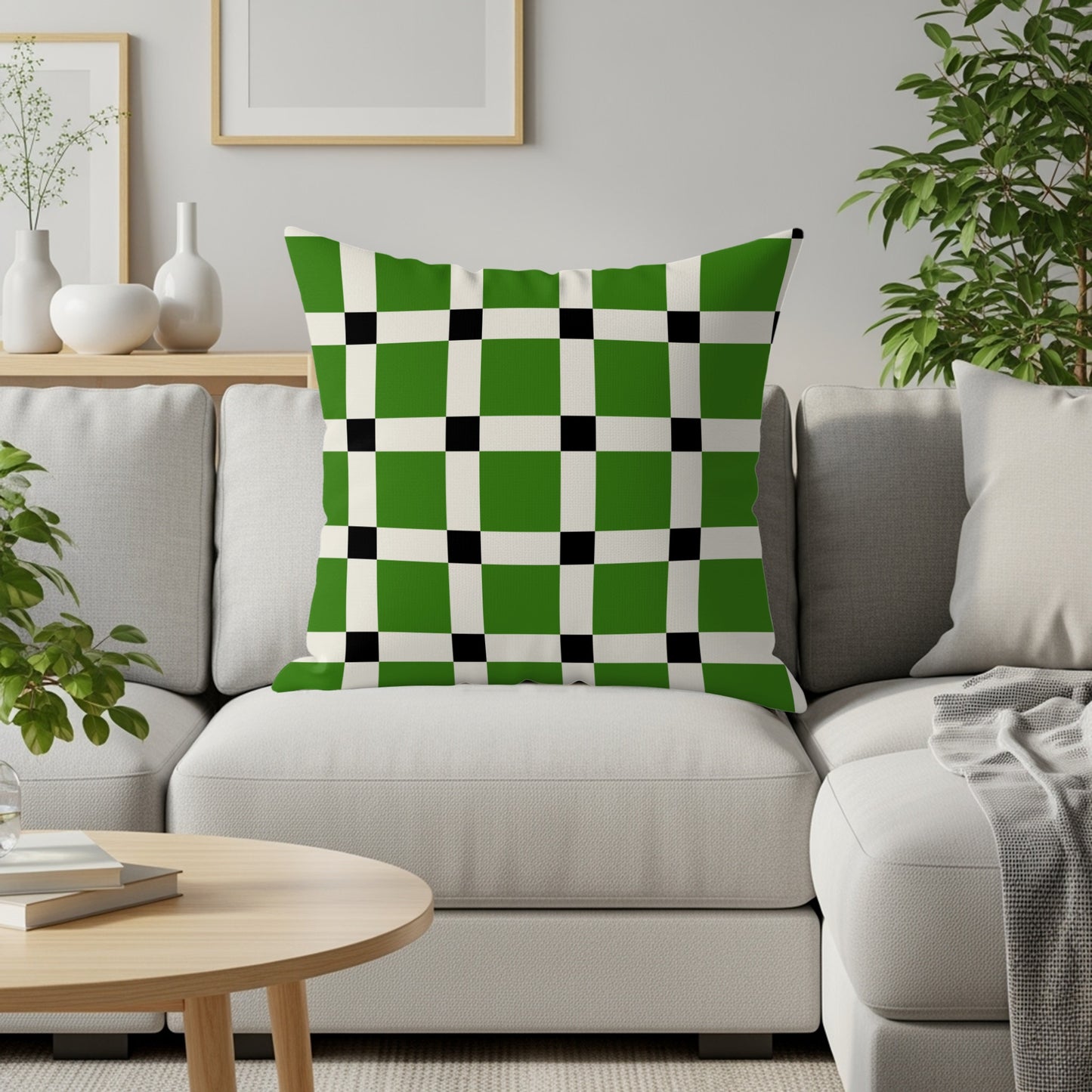 Green, white, and black checkered throw pillow on a light gray sofa.