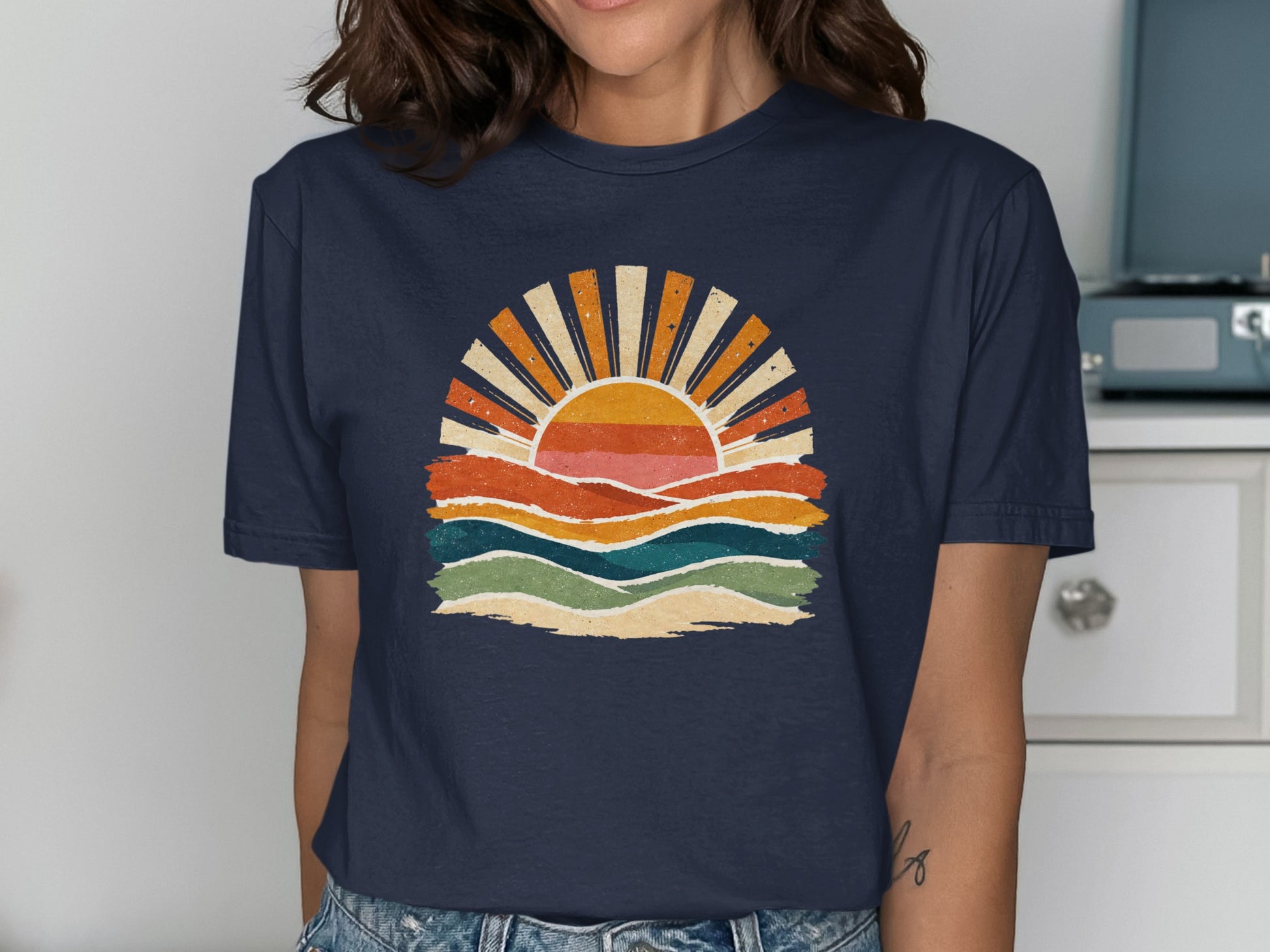 Navy t-shirt with a retro sunset over wavy lines design.
