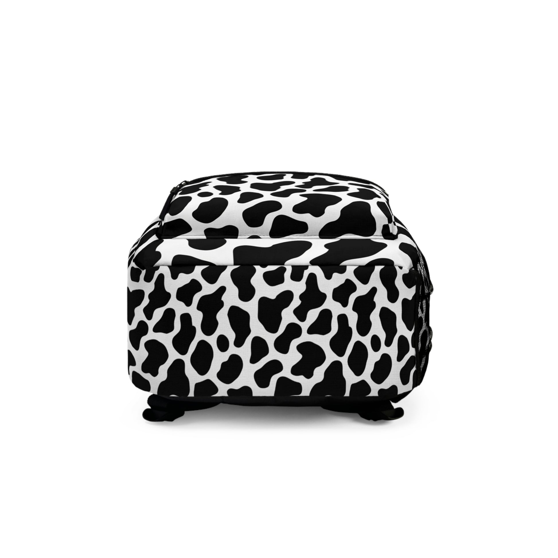 Black and white cow print backpack with black straps and white background.