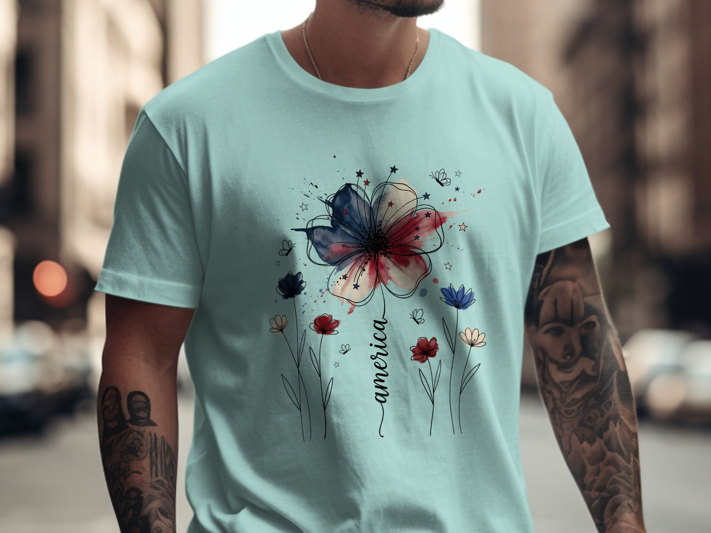 Light blue t-shirt with "America" text and a watercolor flower design.