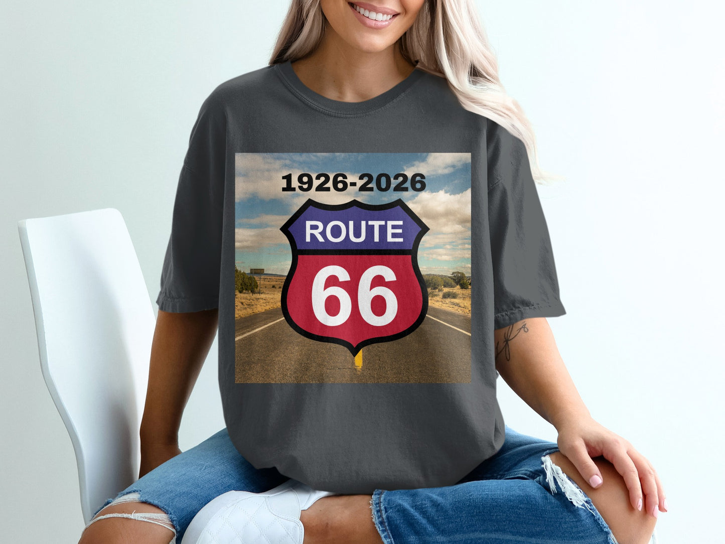 Route 66 shield with years 1926-2026 superimposed on a desert highway.