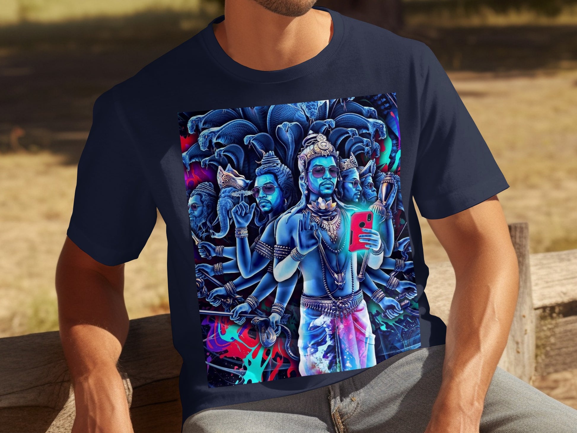 Dark navy t-shirt with vibrant, multi-armed depiction of Hindu deity holding a smartphone.