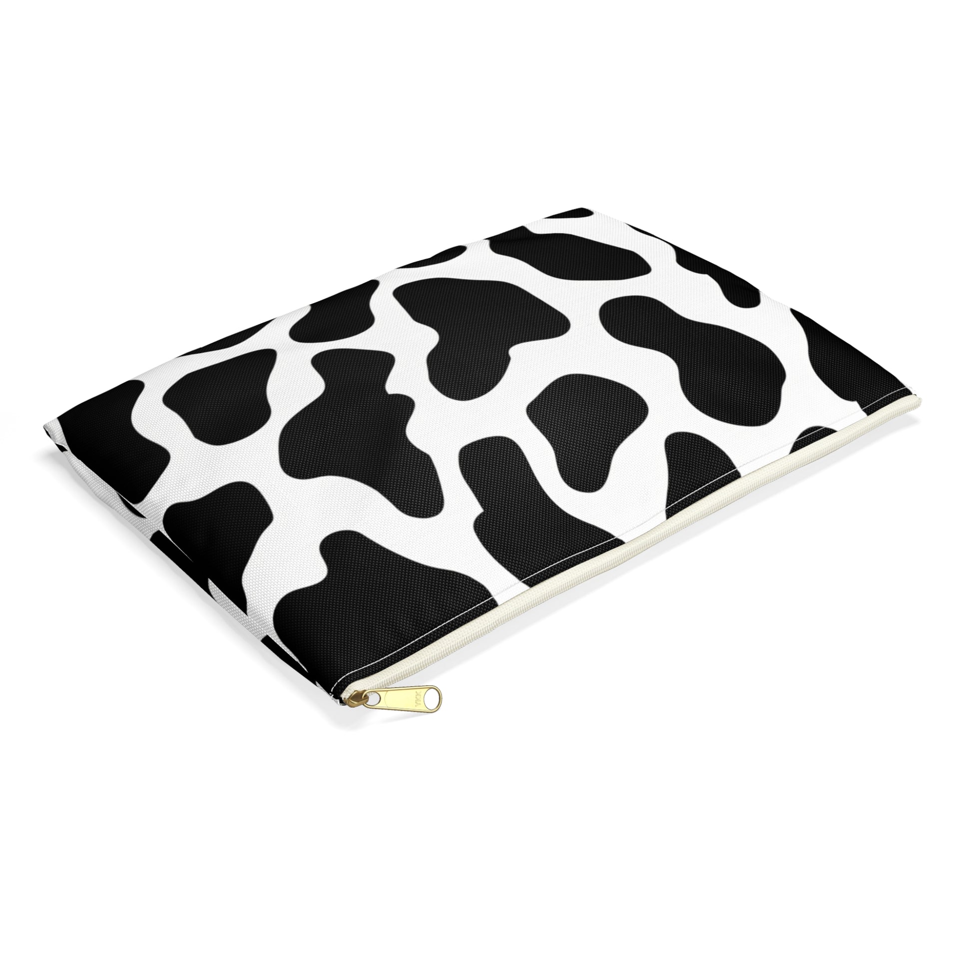 Pouch with black and white cow print pattern and gold zipper