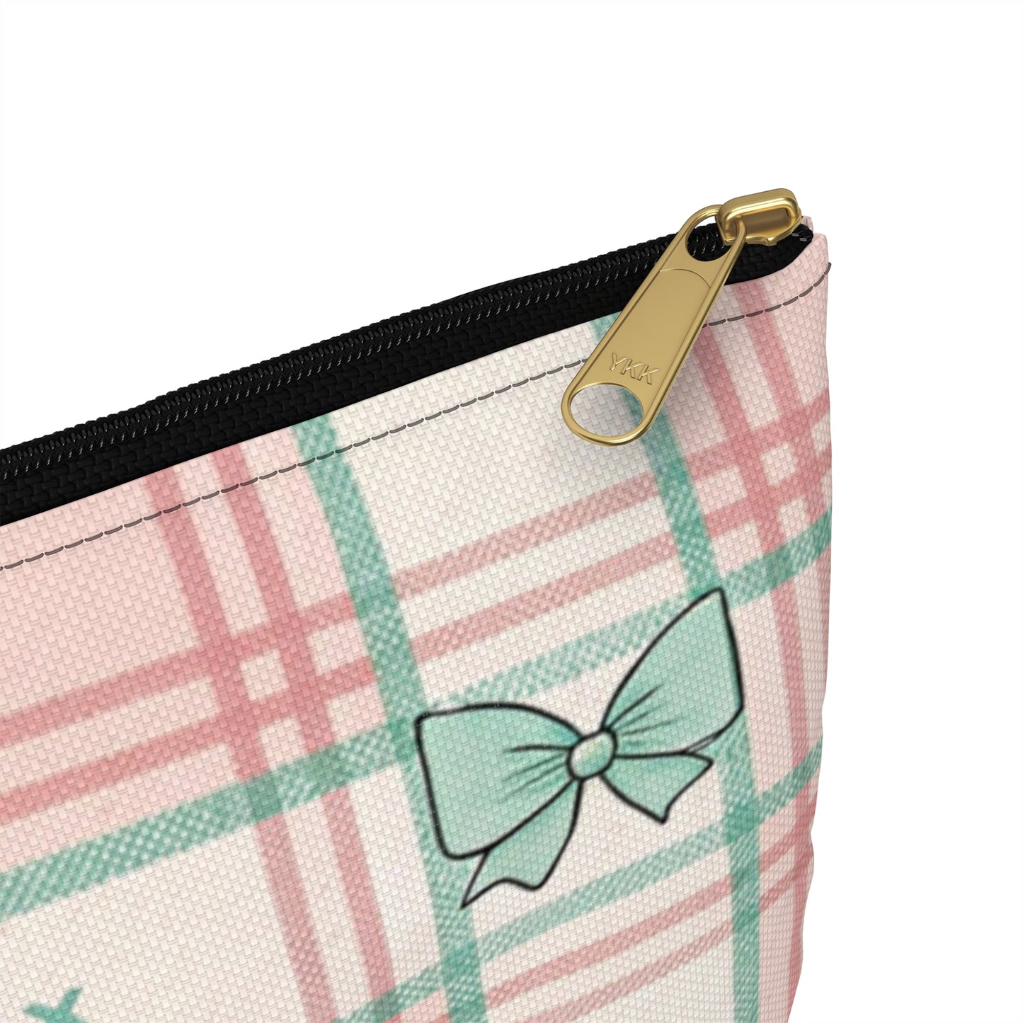 Plaid cosmetic bag with a teal bow and YKK zipper detail.