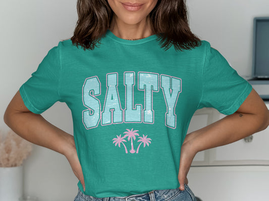 Teal t-shirt with "SALTY" and two pink palm trees.
