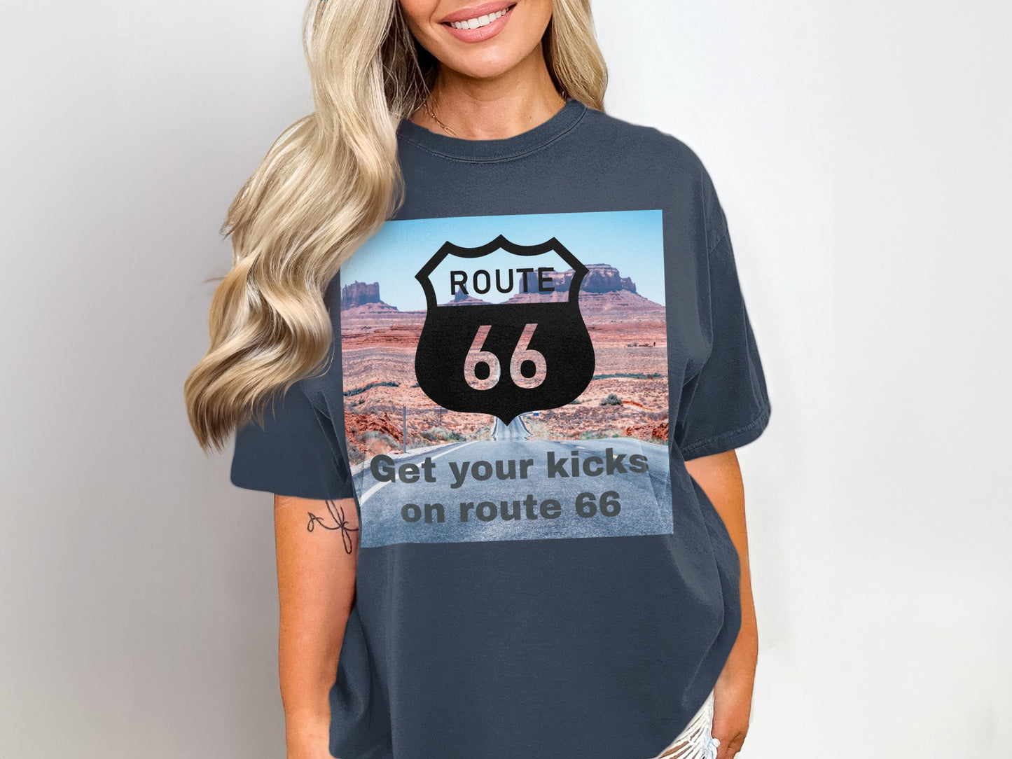 T-shirt graphic with Route 66 shield over desert highway landscape.