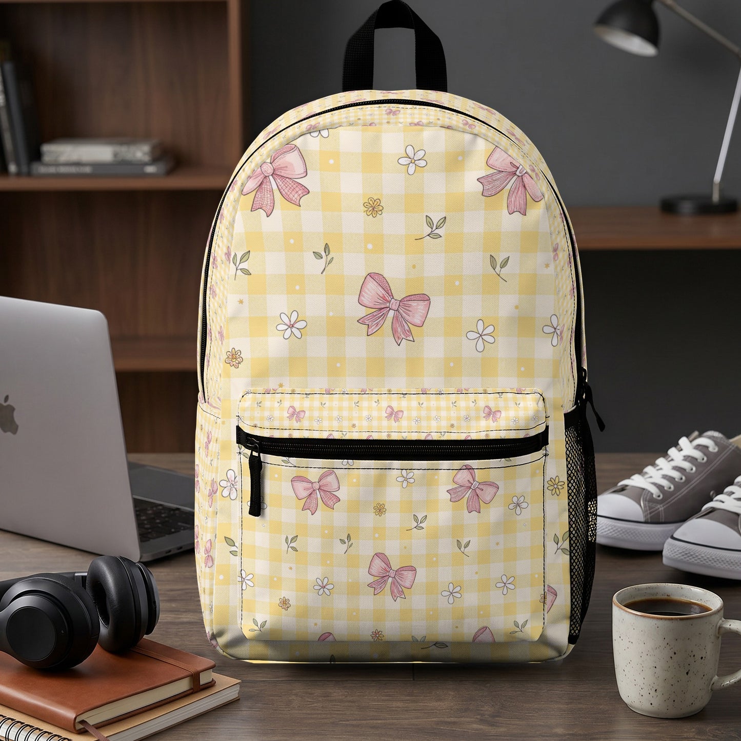 Yellow checkered backpack with pink bow and flower pattern