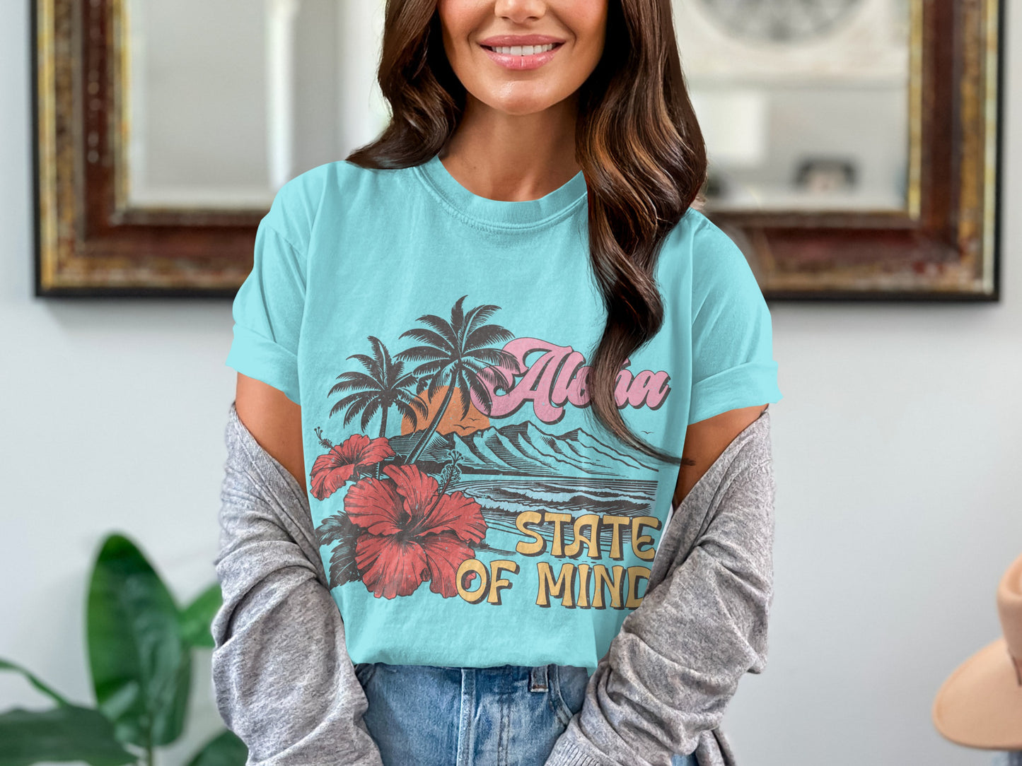 Blue t-shirt with "Aloha State of Mind" text and tropical graphic.