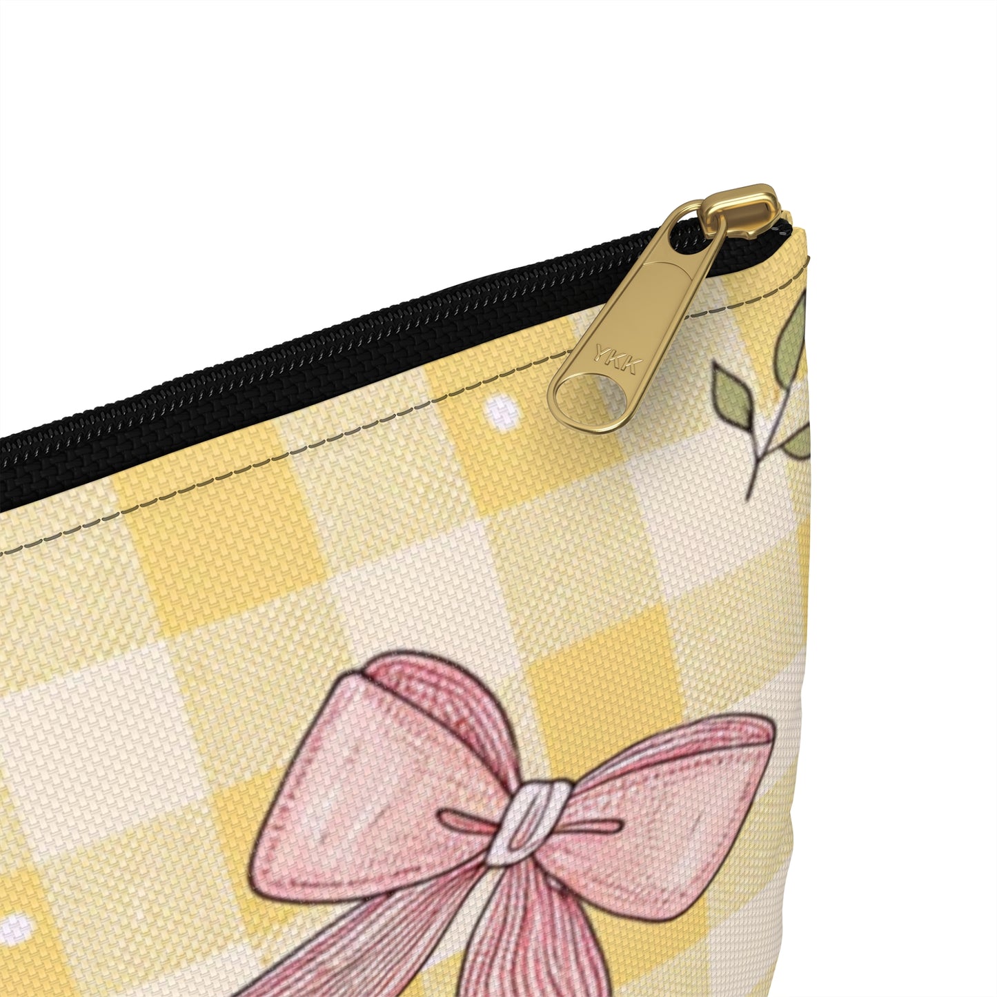 Pouch with yellow gingham, pink bow, leaves, and a YKK zipper.