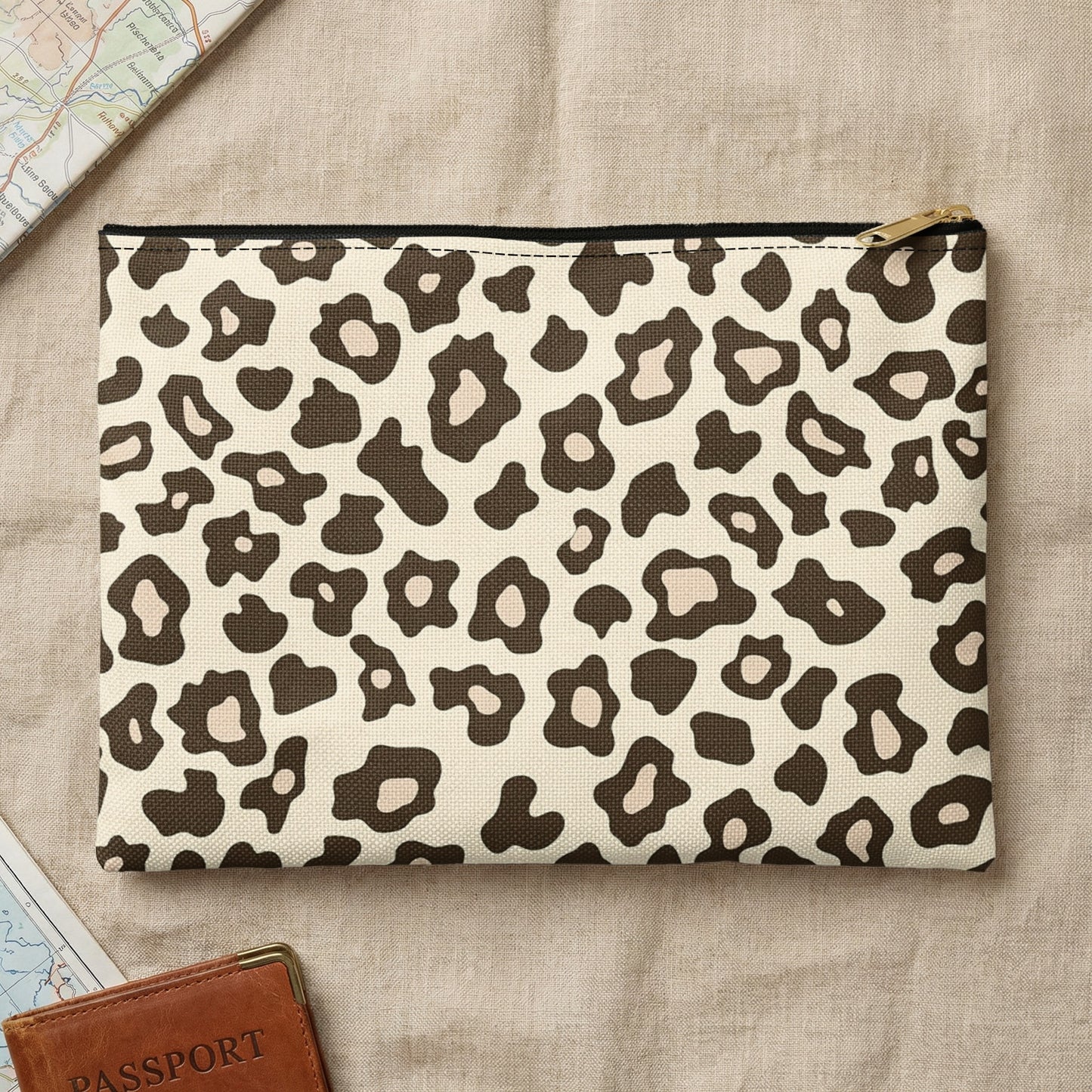 Zippered pouch with a brown and beige leopard print on canvas.
