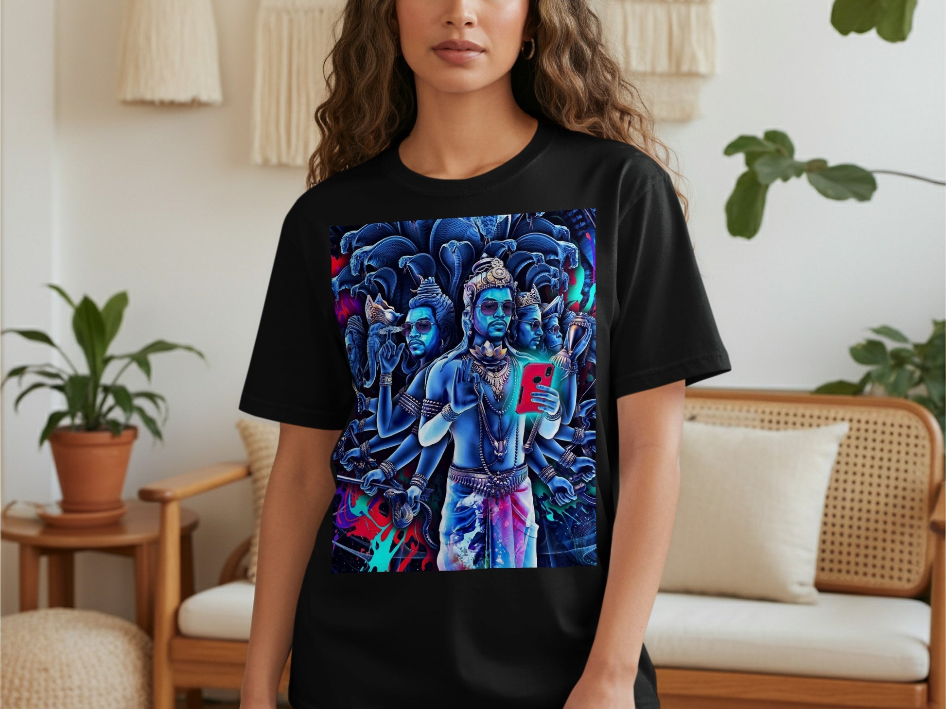 Black t-shirt with a vibrant, multi-armed blue deity holding a red smartphone.