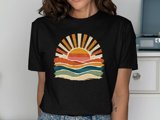 Black t-shirt with a retro sunset and wavy lines design.