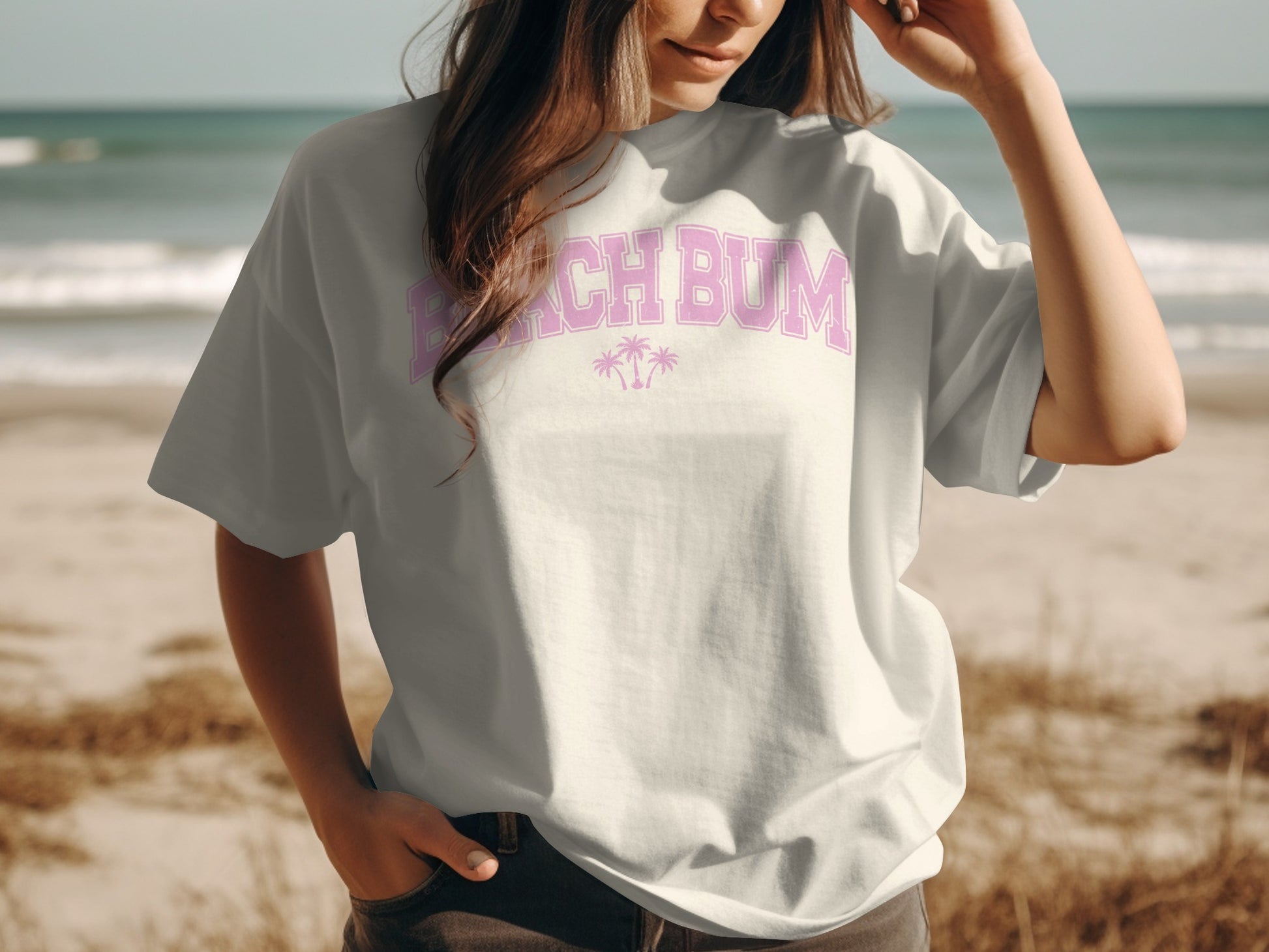 White t-shirt with pink "Beach Bum" text and palm tree graphics.