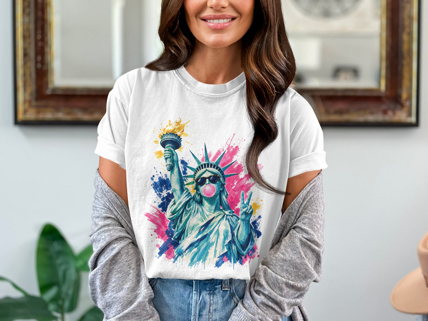 Statue of Liberty wearing sunglasses, holding torch and peace sign, with colorful splashes.