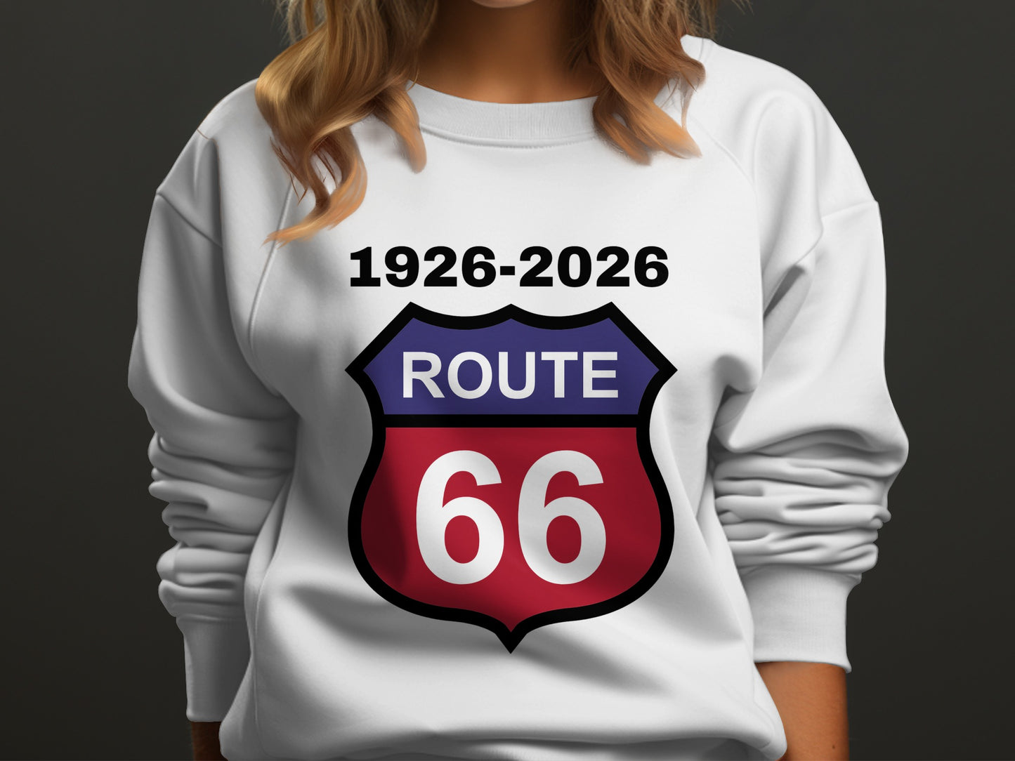 White sweatshirt with a shield logo reading "Route 66 1926-2026".