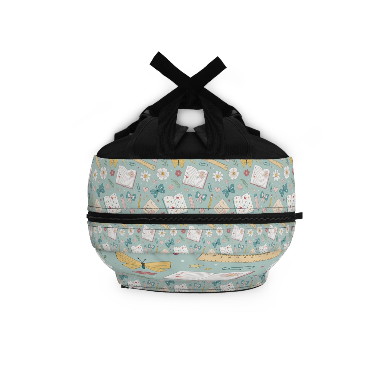 Backpack with a pastel green pattern of books, butterflies, flowers, and rulers.
