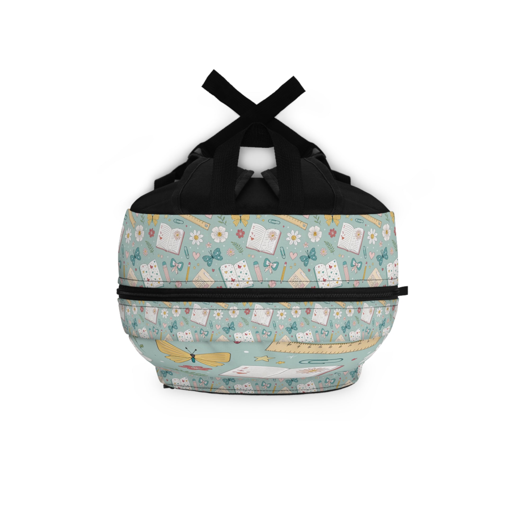 Backpack with a pastel green pattern of books, butterflies, flowers, and rulers.