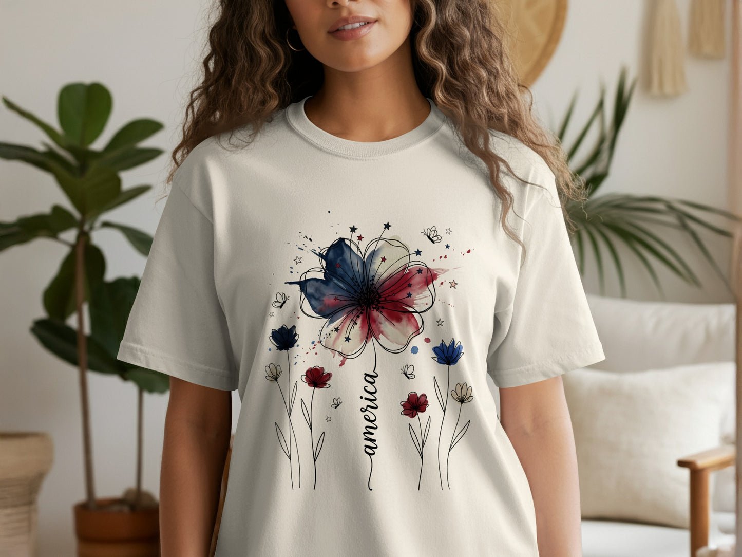 T-shirt with watercolor floral design and "America" text.