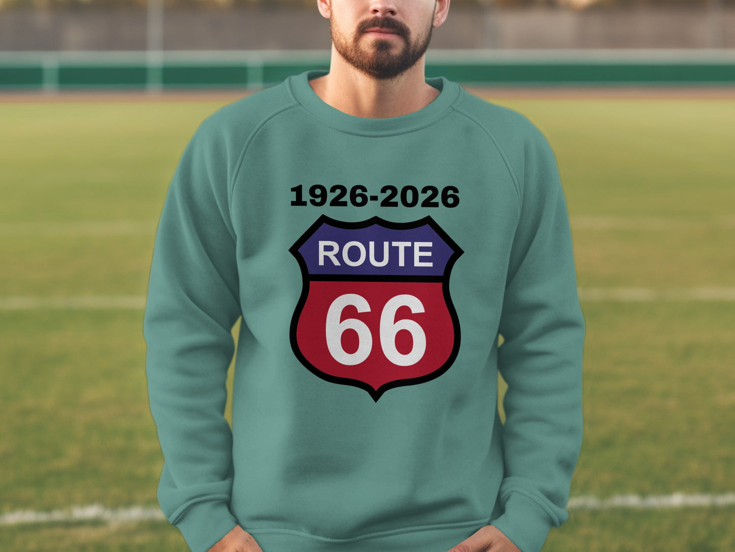 Teal sweatshirt with "Route 66 1926-2026" text on a shield.