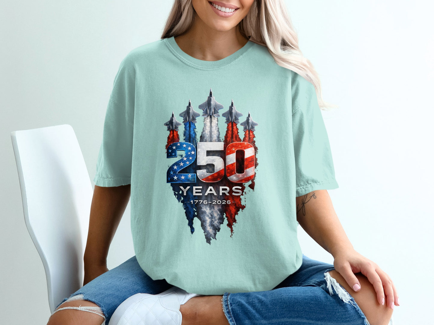Light blue t-shirt with 250 Years 1776-2026 text and fighter jets.