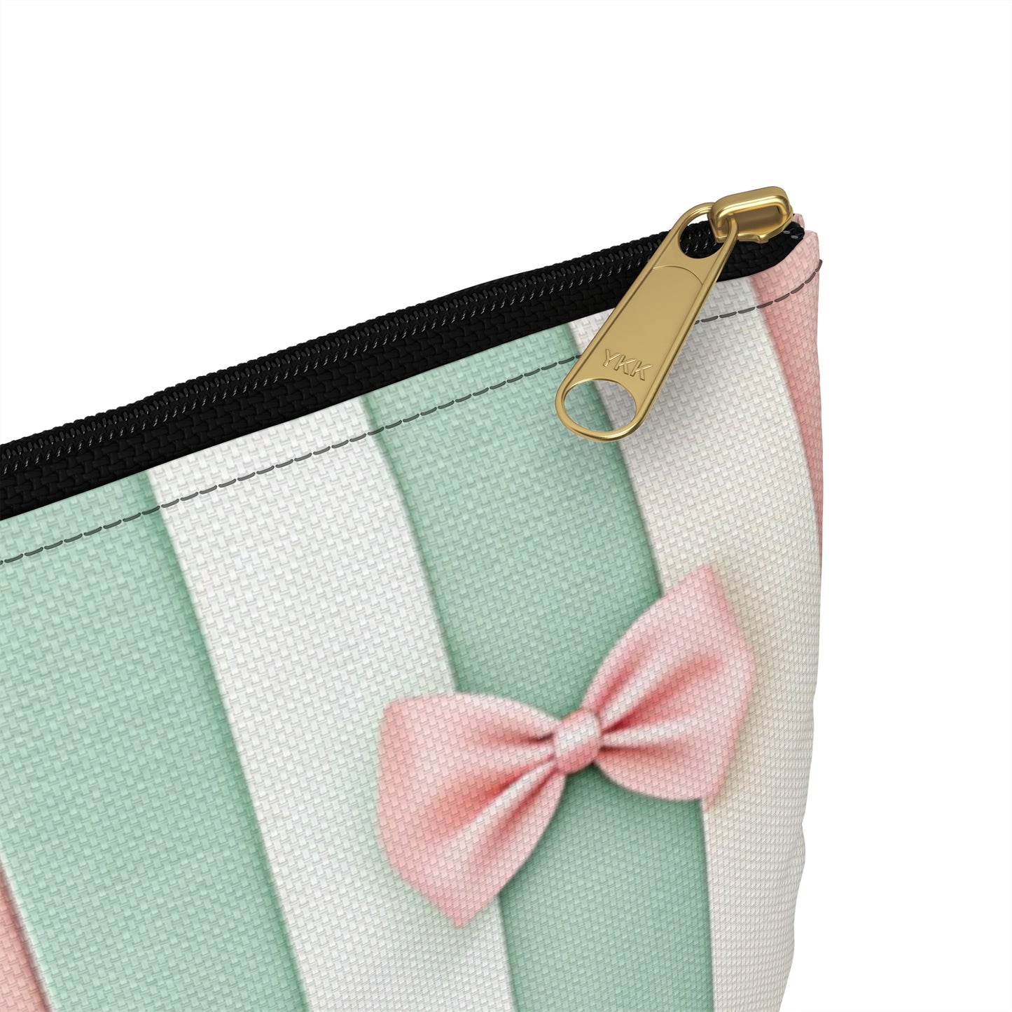 Striped cosmetic bag with a pink bow and gold YKK zipper.