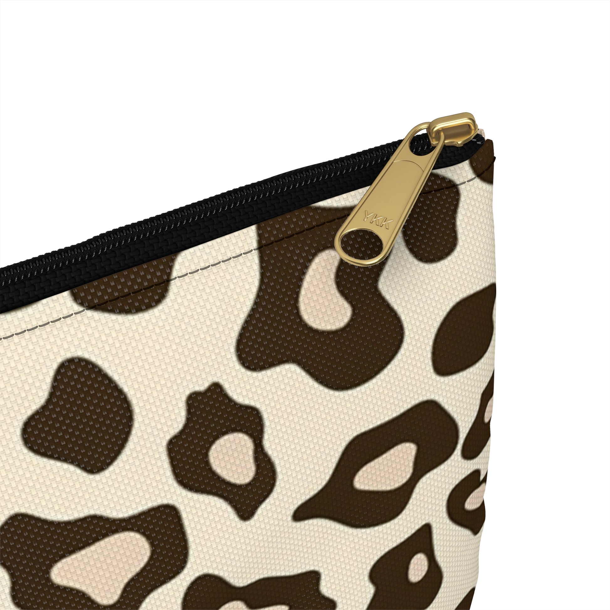 Cosmetic bag with leopard print and gold YKK zipper.