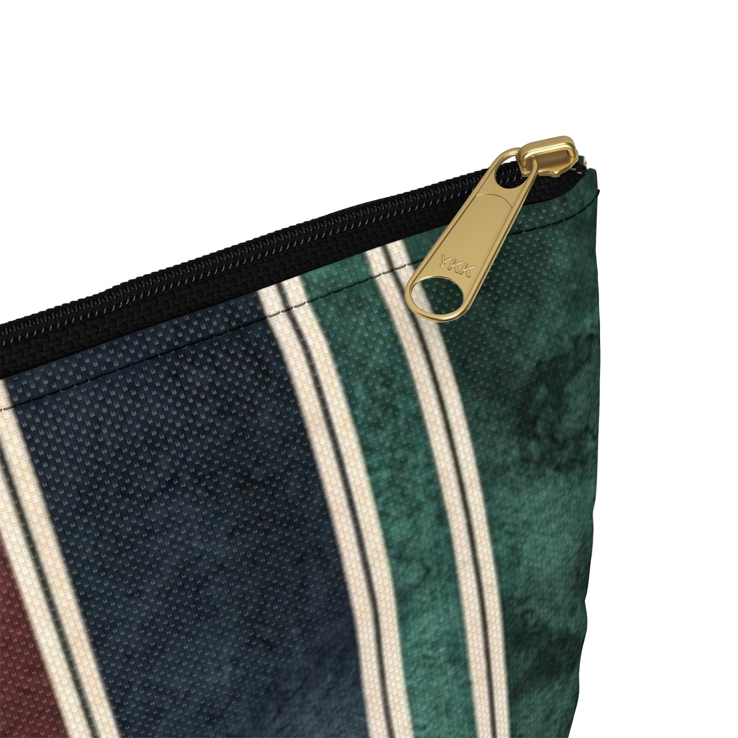 Striped pouch with brass YKK zipper and white background.