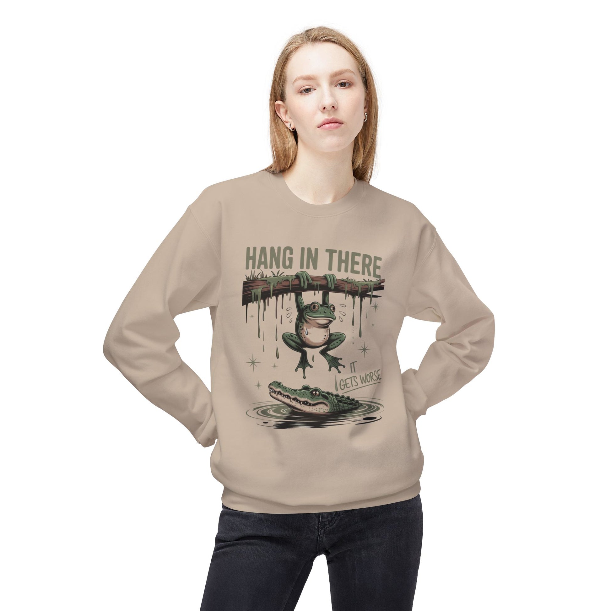 Sand sweatshirt with a frog hanging from a branch over an alligator.