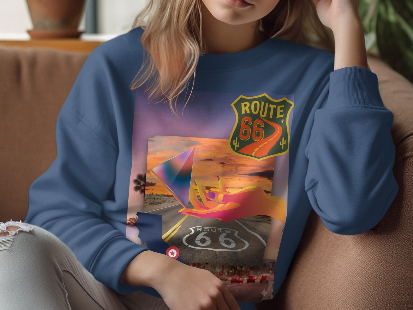 Woman wearing a Route 66 themed sweatshirt with desert landscape.